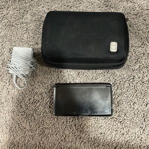 Black Nintendo 3DS. Good condition.